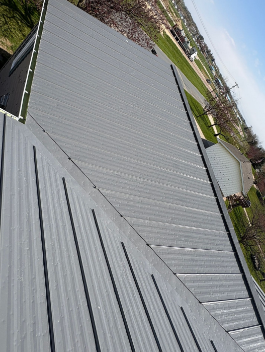 Standing seam metal roof installation in Lansing, IA.