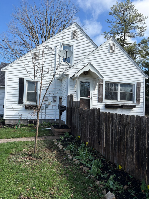 Front view of kitchen remodeling with new siding and windows in Lansing, IA.