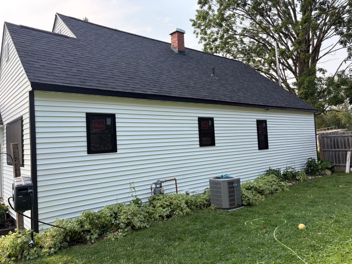 New siding and roofing installation on a house in Lansing, IA.