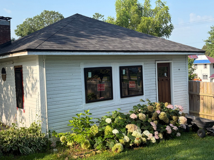 New windows and siding installed on a garage in Lansing, IA.