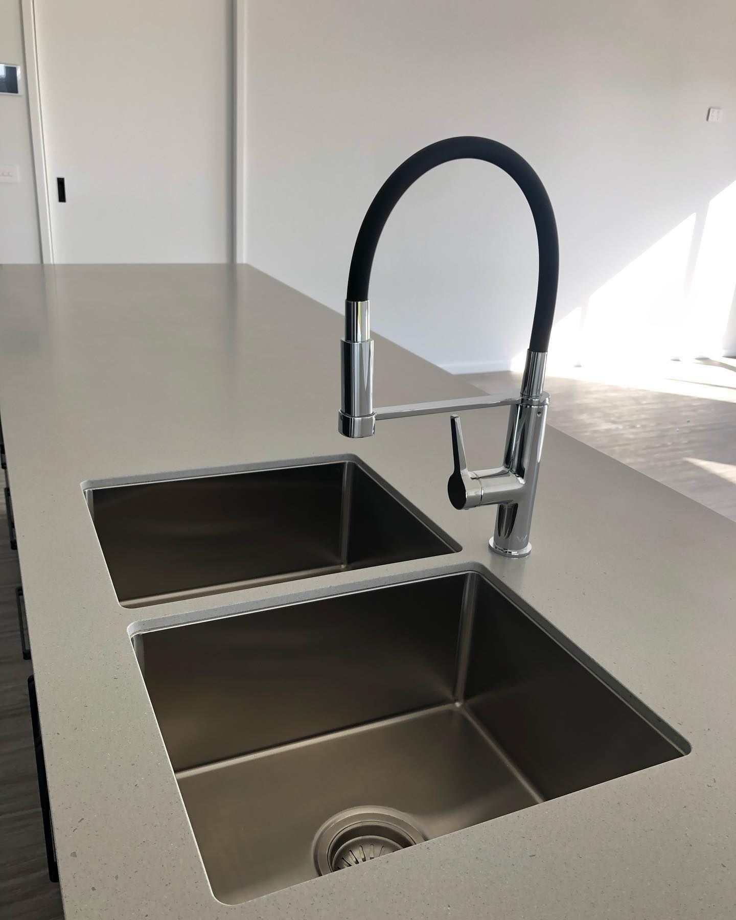 A Kitchen Sink With Two Sinks and a Faucet — Evoke Building Group In Ballarat Central, VIC