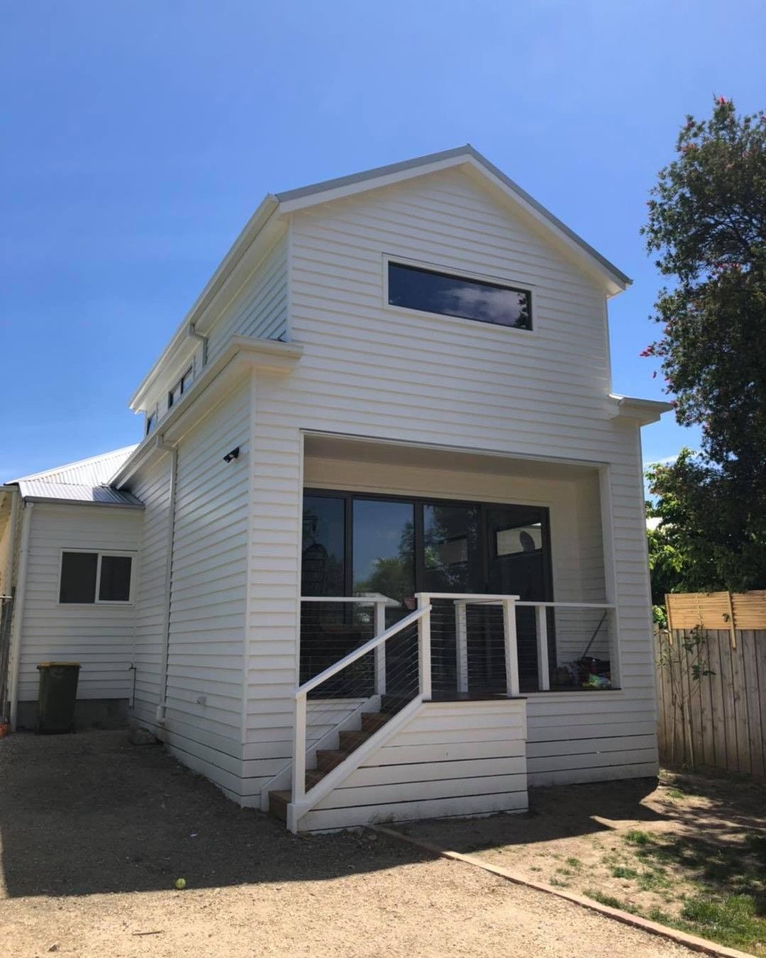 A White House With Stairs Leading Up to the Second Floor — Evoke Building Group In Ballarat Central, VIC