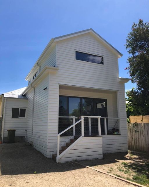 A White House With Stairs Leading Up to the Second Floor — Evoke Building Group In Ballarat Central, VIC
