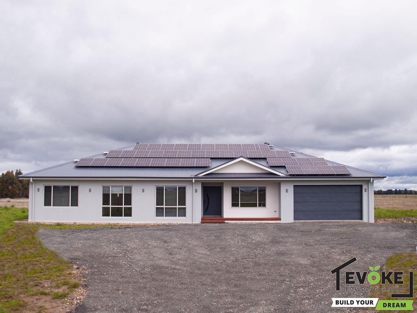 A Large House is Sitting on Top of a Dirt Hill — Evoke Building Group In Ballarat Central, VIC