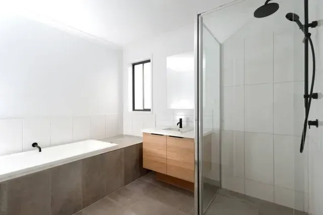 A Bathroom With a Bathtub , Sink , and Shower — Evoke Building Group In Ballarat Central, VIC