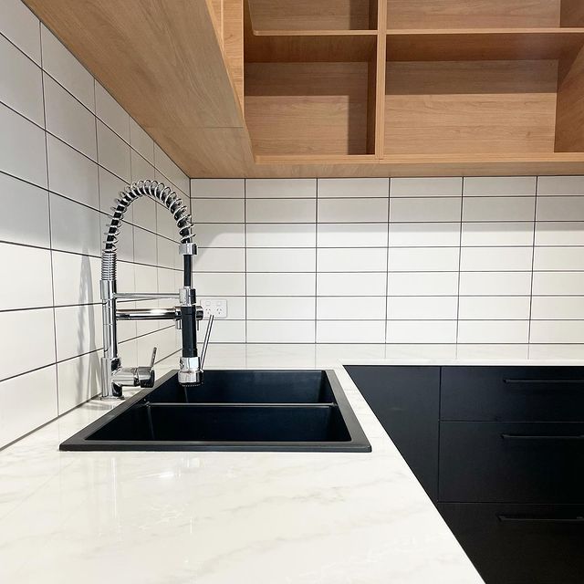 A Kitchen With a Black Sink and a Faucet — Evoke Building Group In Ballarat Central, VIC