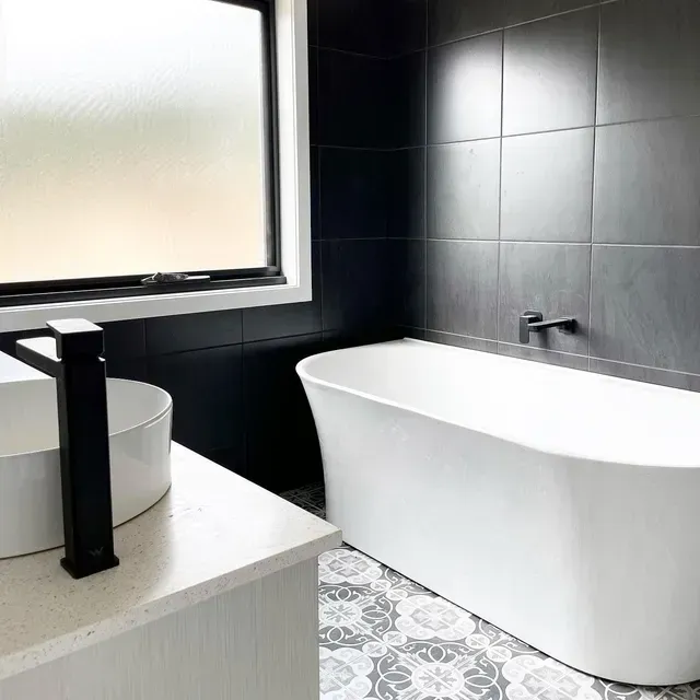 A Bathroom With a Bathtub , Sink , and Window — Evoke Building Group In Ballarat Central, VIC