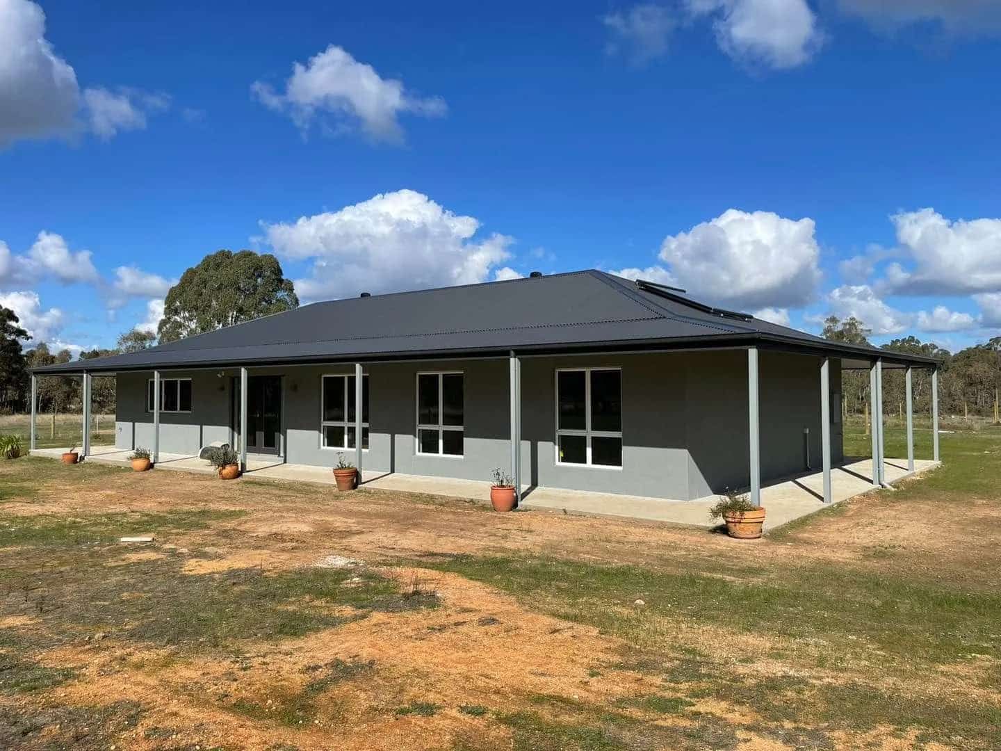 Grey House with a Black Roof and a Porch — Evoke Building Group In Bendigo, VIC