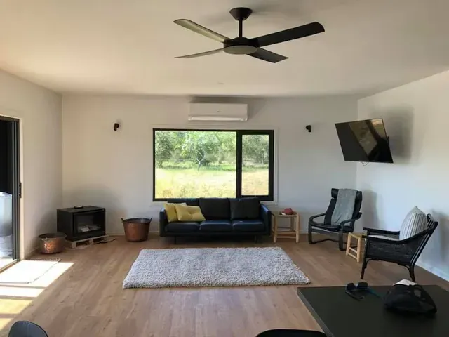 A Living Room With a Ceiling Fan and a Couch — Evoke Building Group In Ballarat Central, VIC