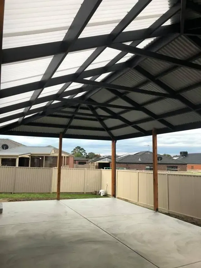 An Empty Patio With a Roof and a Fence in the Background — Evoke Building Group In Bendigo, VIC