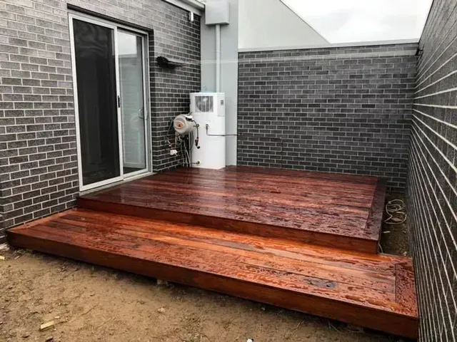 There is a Wooden Deck in the Backyard of a House — Evoke Building Group In Ballarat Central, VIC