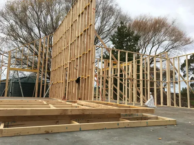 A Large Wooden Structure is Being Built in a Parking Lot — Evoke Building Group In Daylesford, VIC