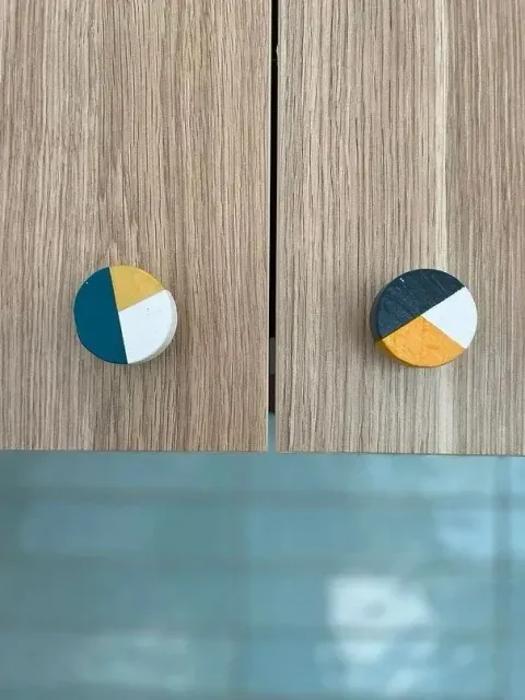 A Close Up of Two Wooden Cabinet Handles on a Wooden Cabinet — Evoke Building Group In Ballarat Central, VIC