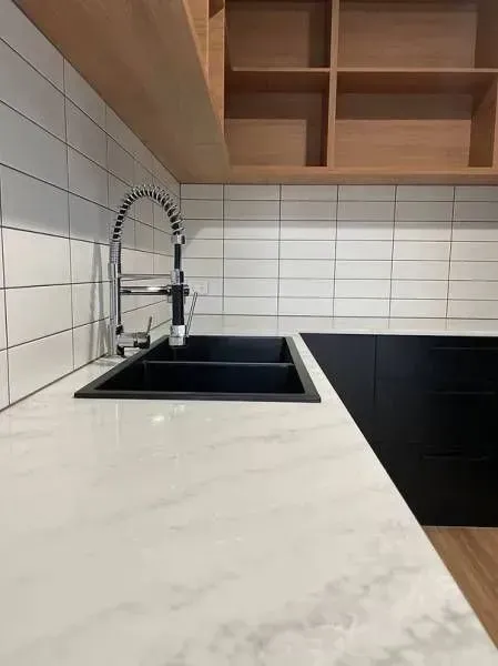 A Kitchen With a Sink and a Stove Top Oven — Evoke Building Group In Ballarat Central, VIC