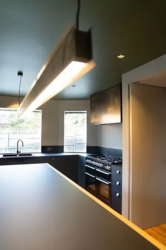 A Kitchen With a Stove Top Oven and a Sink — Evoke Building Group In Ballarat Central, VIC