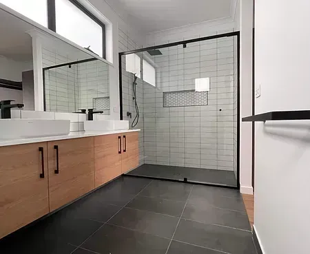 A Bathroom With Two Sinks and a Walk in Shower — Evoke Building Group In Ballarat Central, VIC