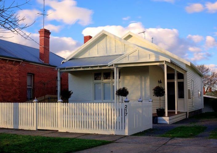 A Small White House With a White Picket Fence — Evoke Building Group In Ballarat Central, VIC