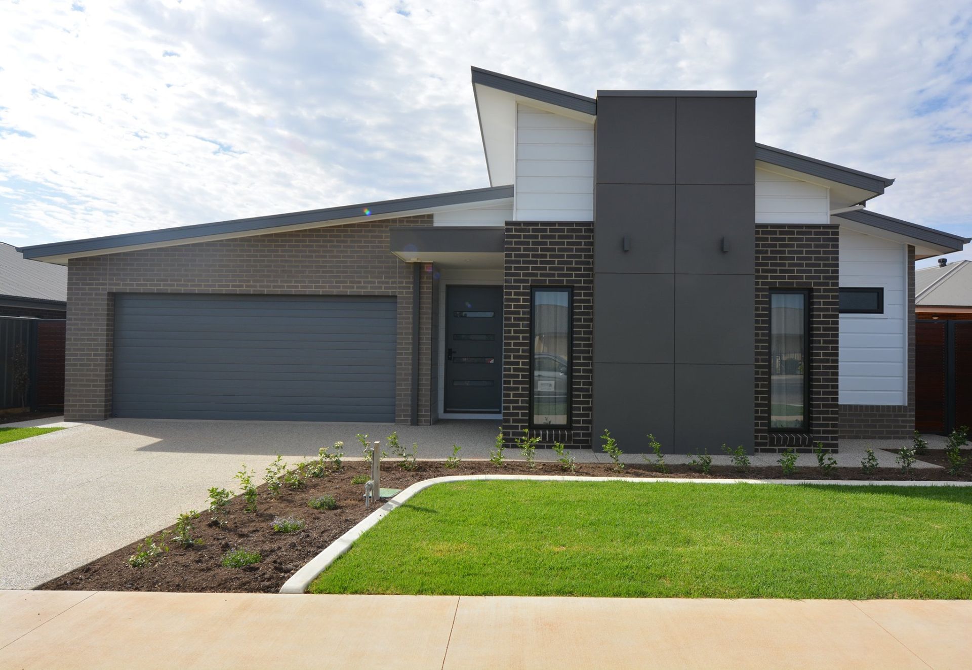 A Patio With a Table and Chairs Under a Covered Roof — Evoke Building Group In Ballarat Central, VIC