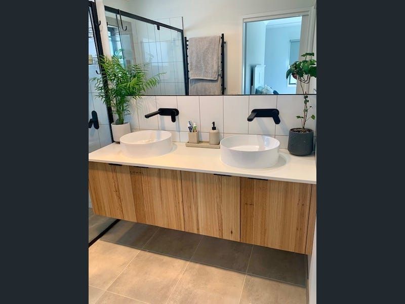 A Bathroom With Two Sinks and a Large Mirror — Evoke Building Group In Ballarat Central, VIC