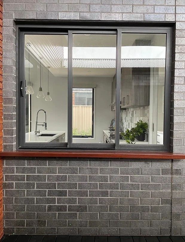 A Small White House With a Balcony and Stairs — Evoke Building Group In Ballarat Central, VIC