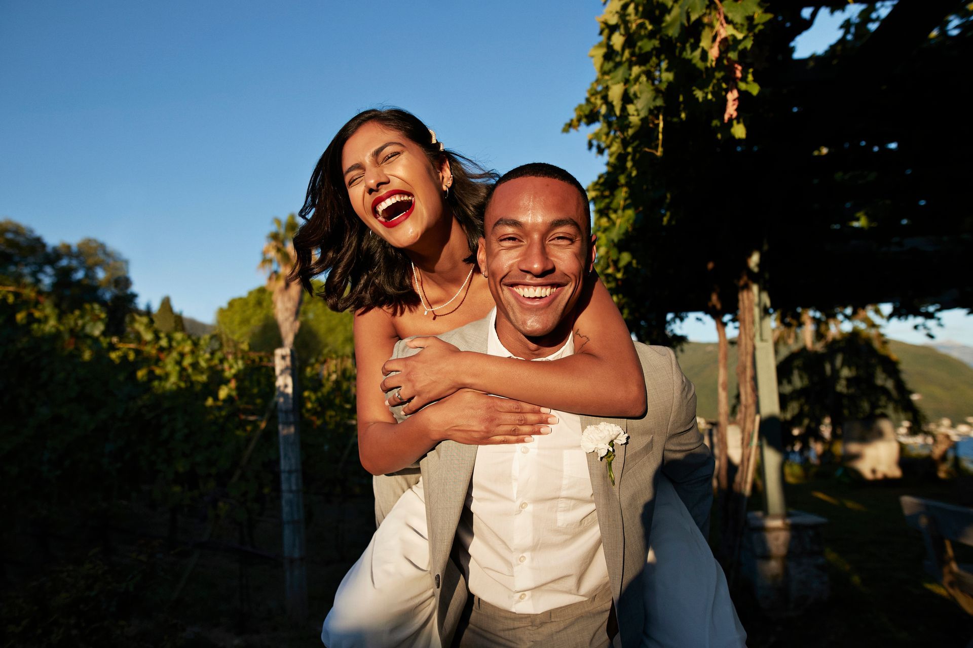 A man is carrying a woman on his back.