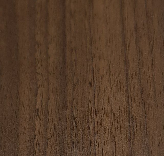 Gloss Walnut Vohringer lightweight ply wood grain sample, providing a modern dark wood look for van kits.
