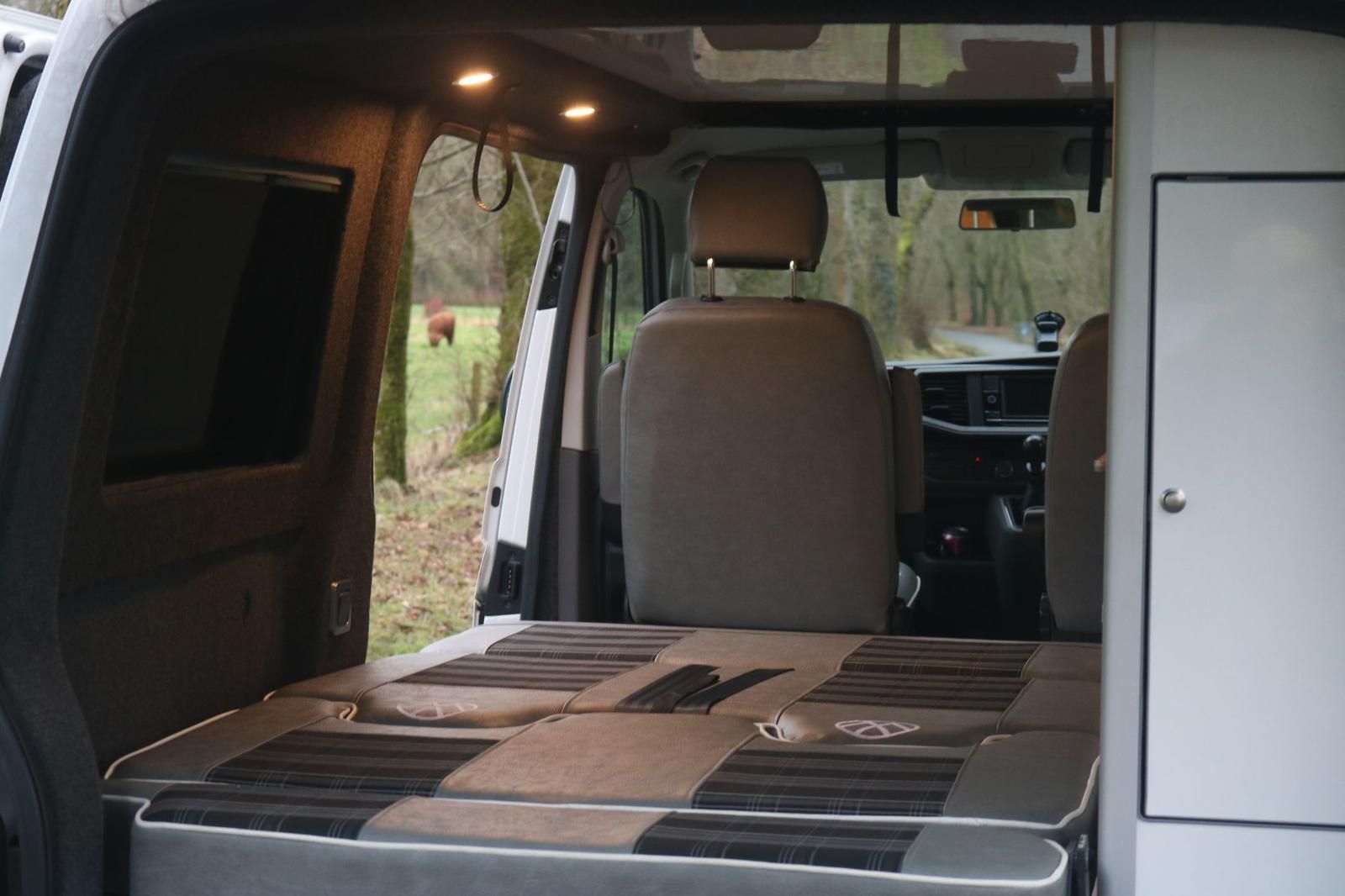 M1 crash tested rock and roll bed installed inside a custom campervan conversion layout