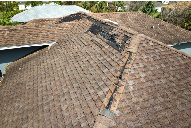The roof of a house has a hole in it.