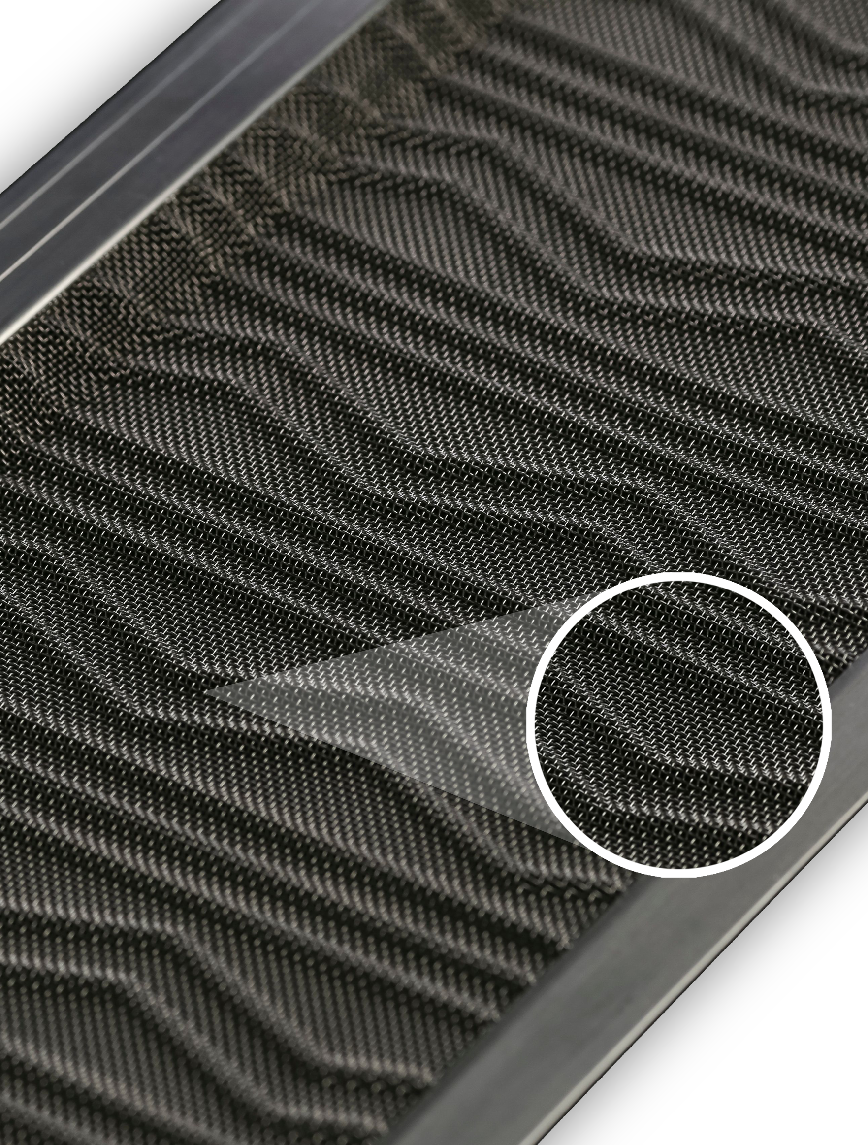 A close up of a black door mat with a circle around it.