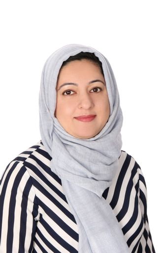 Woman in light blue hijab and striped shirt smiles, white background.
