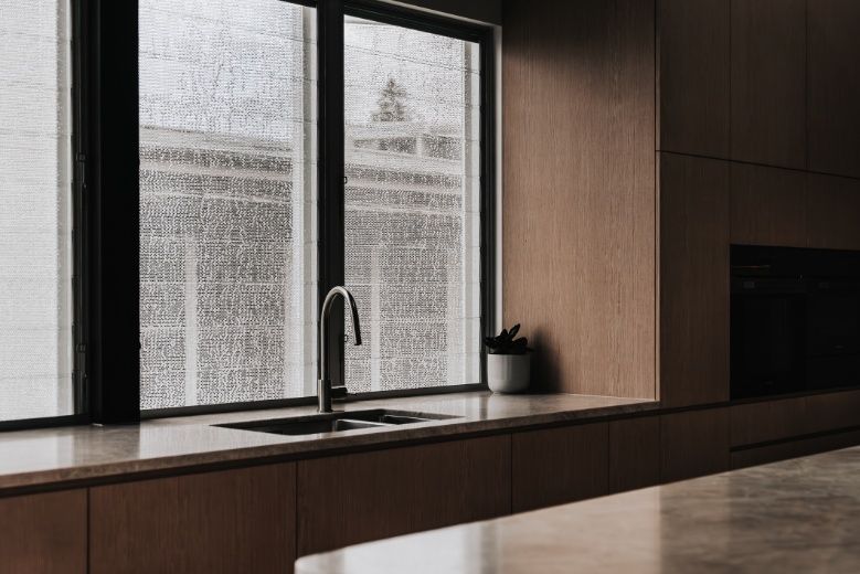 A Kitchen With a Sink and a Window — Architectural Glass Solutions QLD in Cooroy, QLD