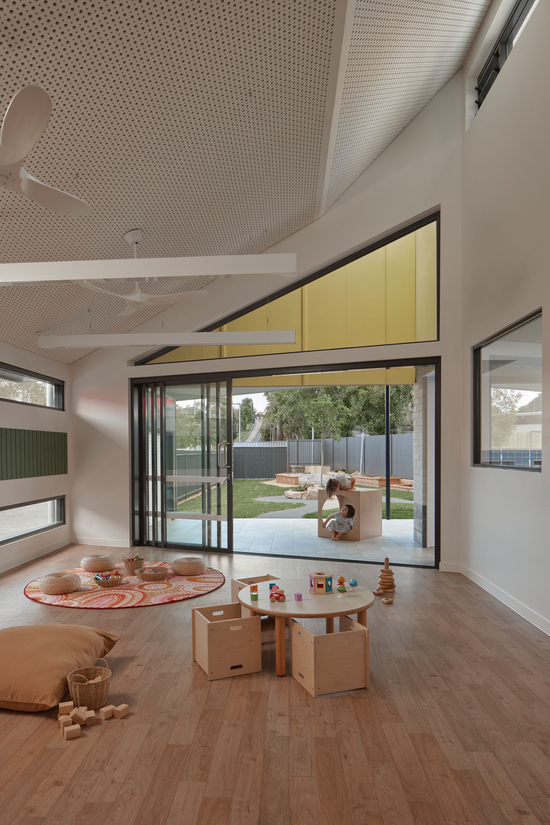 Interior of a Bright Playroom With Wooden Floors, Sliding Glass Doors — Architectural Glass Solutions QLD in Cooroy, QLD
