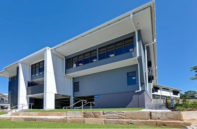A Large Building With Stairs Leading Up to It — Architectural Glass Solutions QLD in Cooroy, QLD