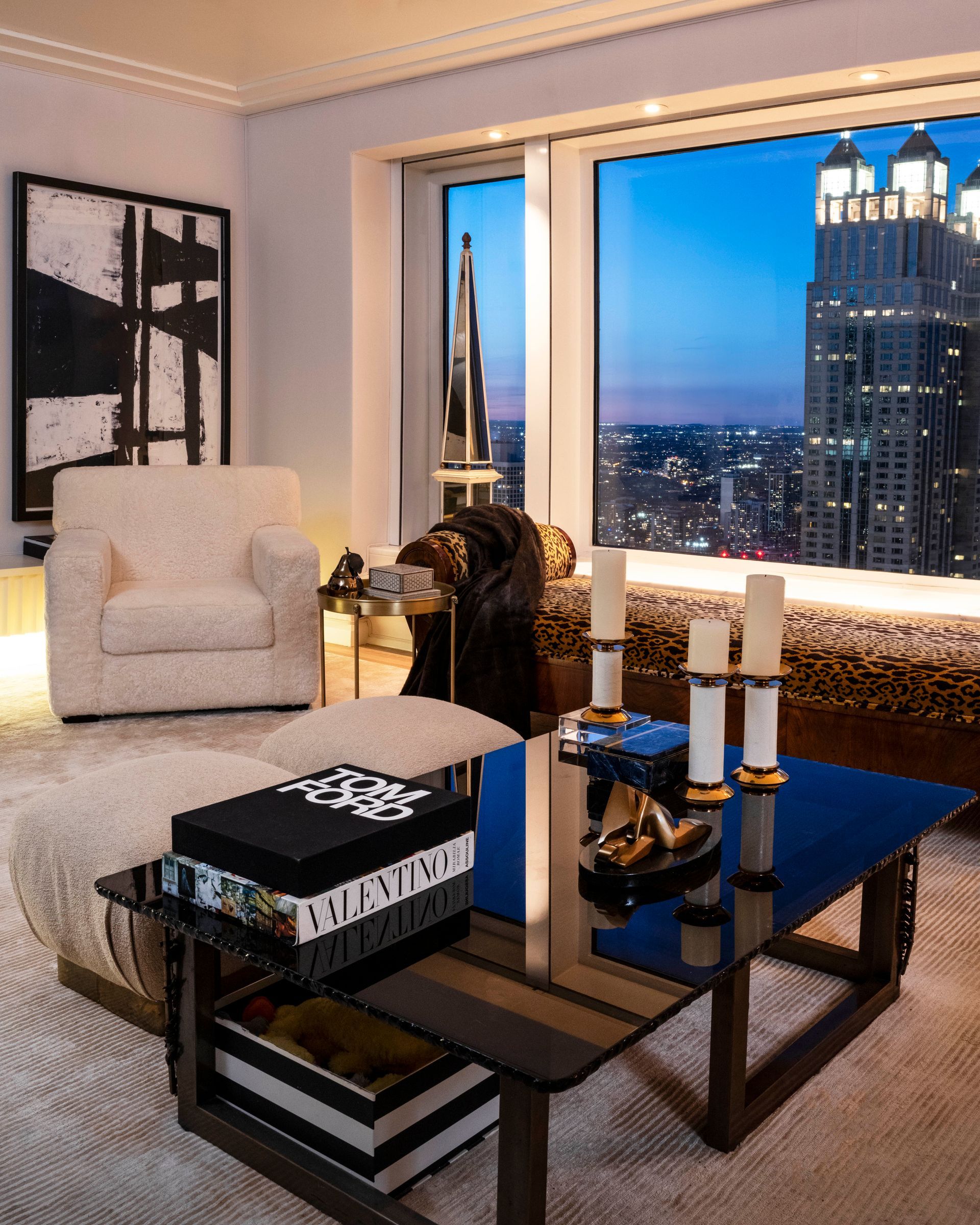 A living room with a chair and a coffee table