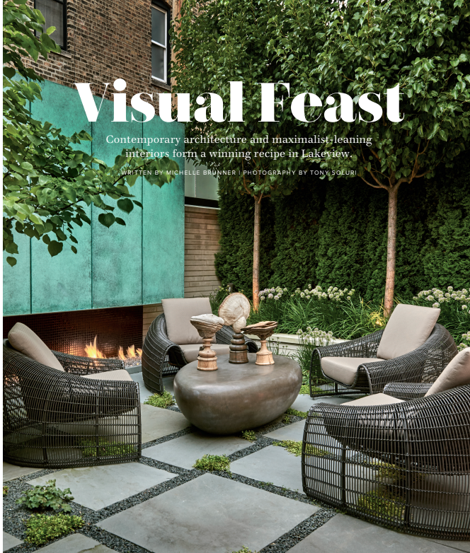 A patio with chairs and a table with the words visual feast on it