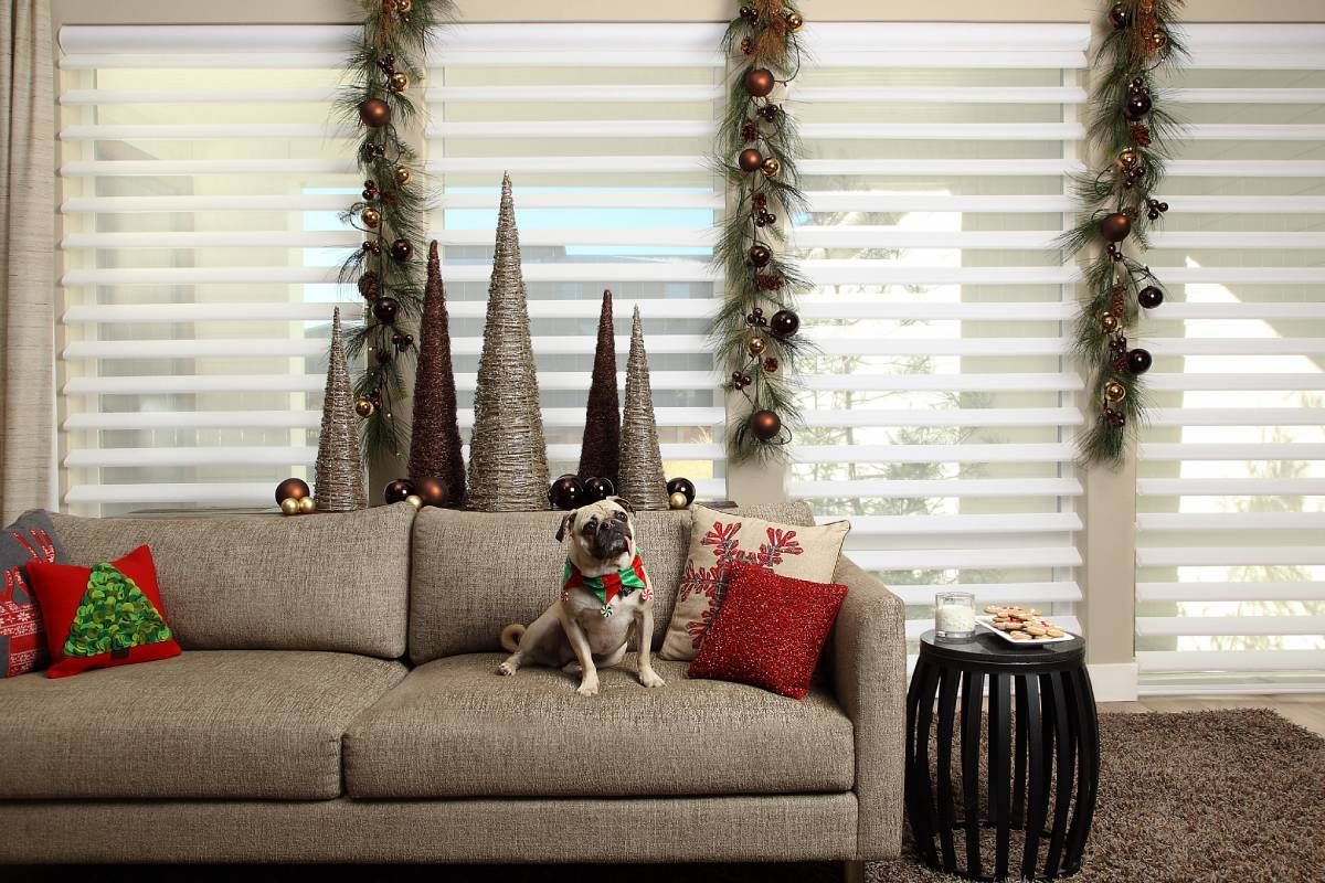 Hunter Douglas Pirouette® Sheer Shades as custom sheer shades on windows in a holiday-decorated living room at Custom Wood Shutters and Blinds near Tustin, CA