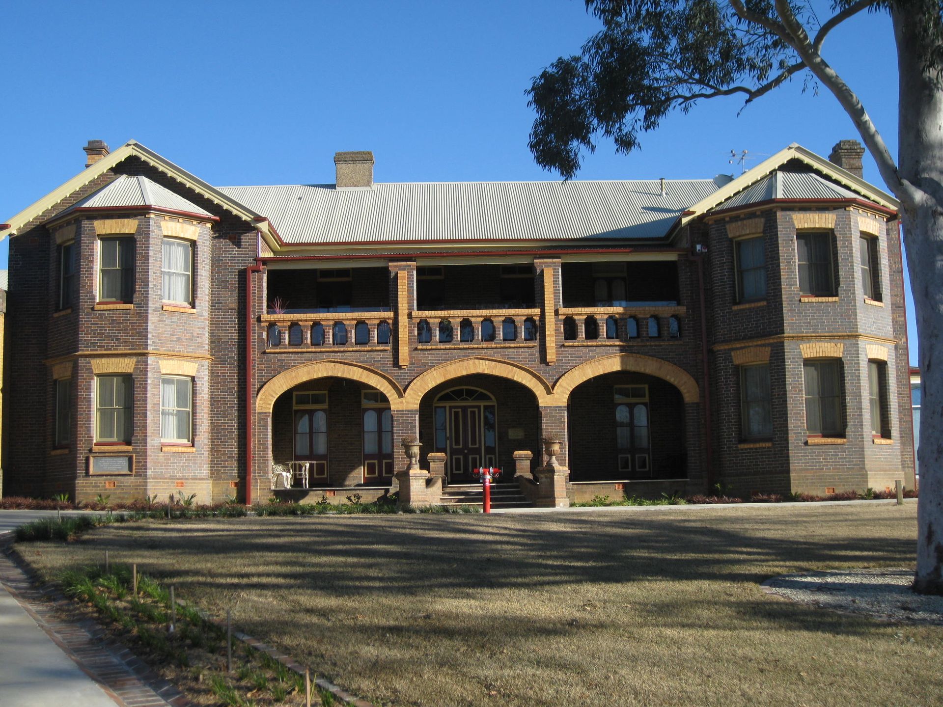 front view of catholic cathedral precinct building with a white roof