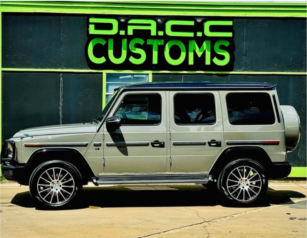 Silver Mercedes-Benz G-Wagon with custom wheels parked outside 