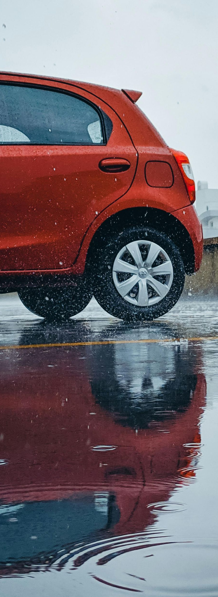 a red car in the rain