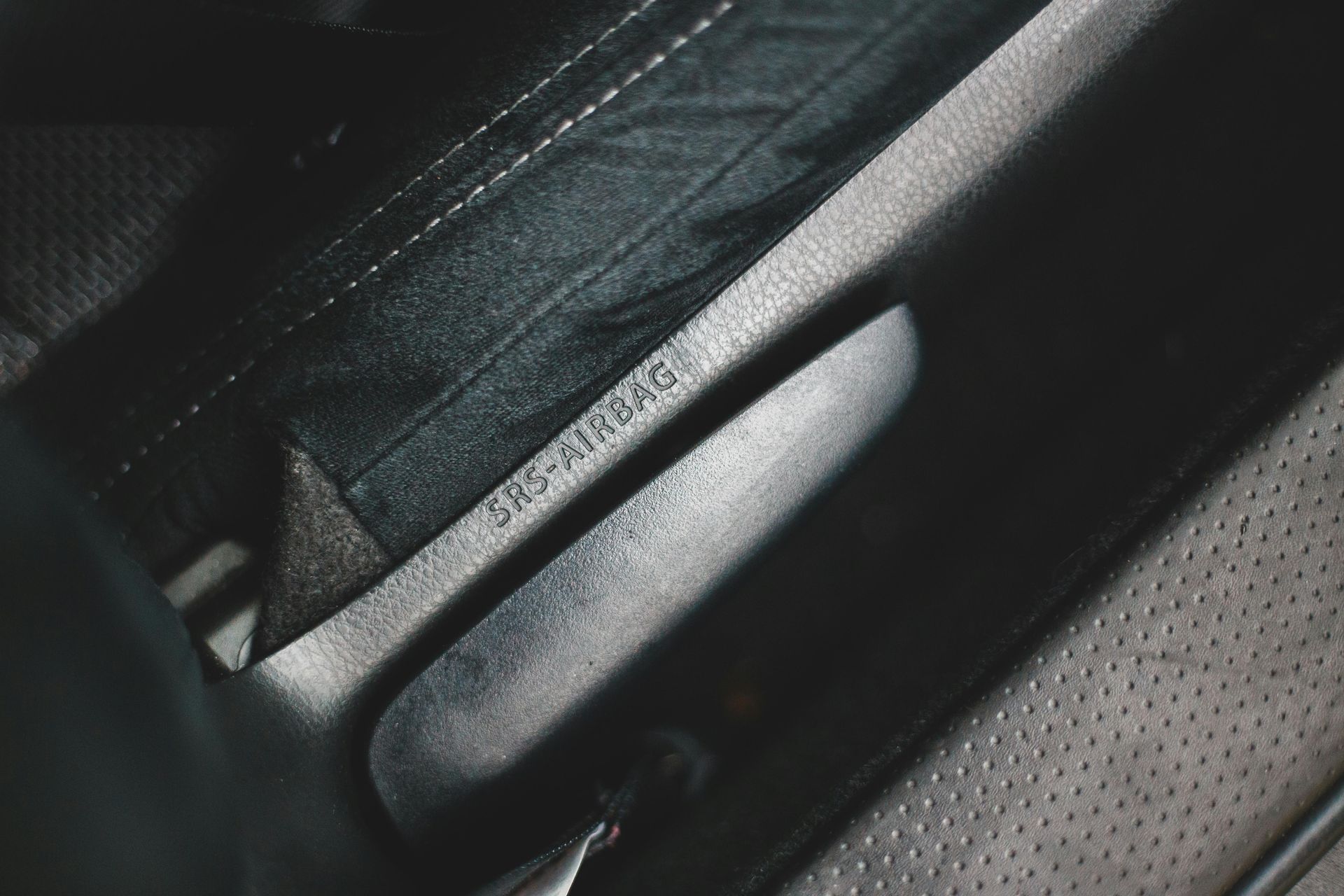Close-up of a car seat with the identification number 
