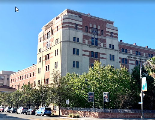 A large building surrounded by trees.