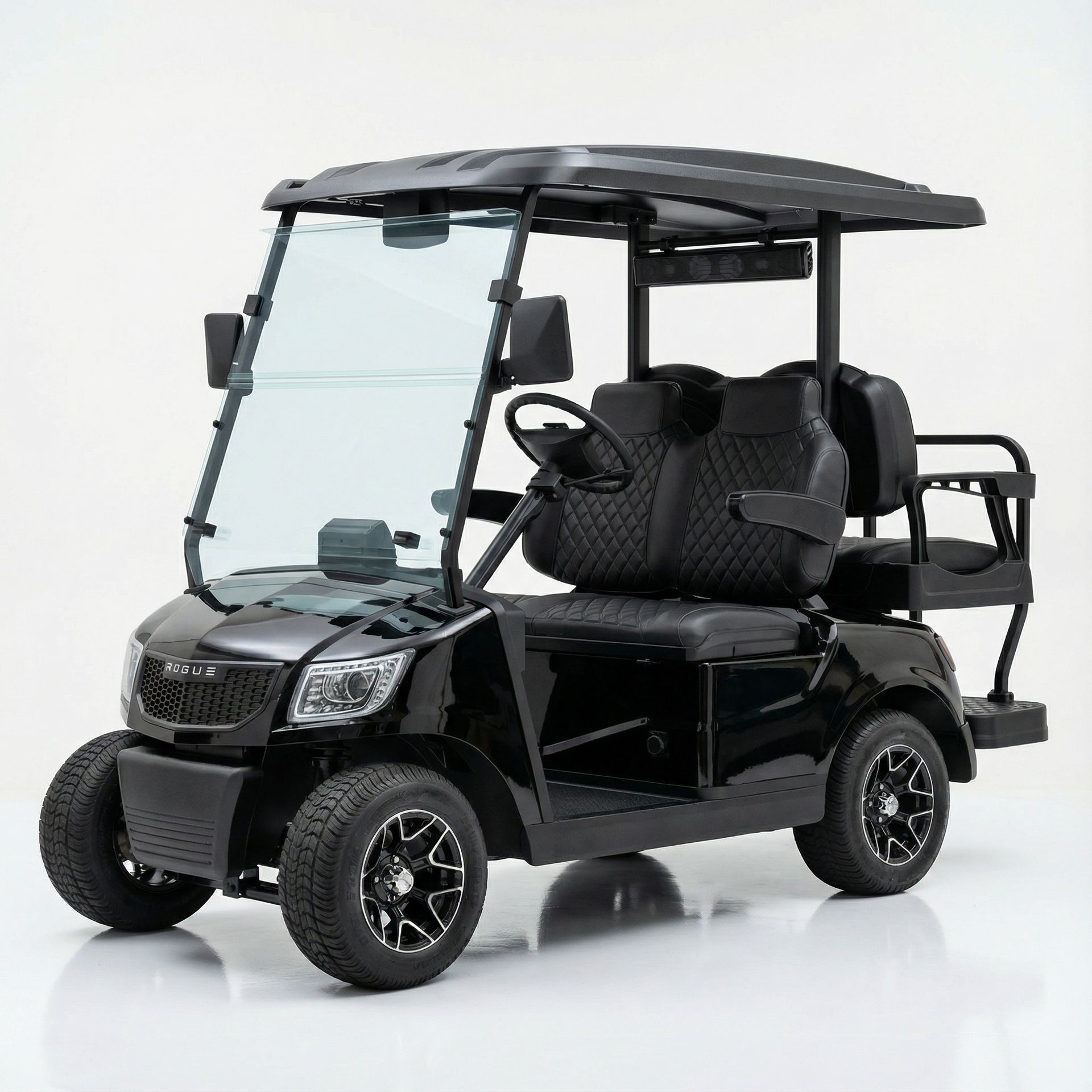 Black golf cart with front windshield, seats, and roof.