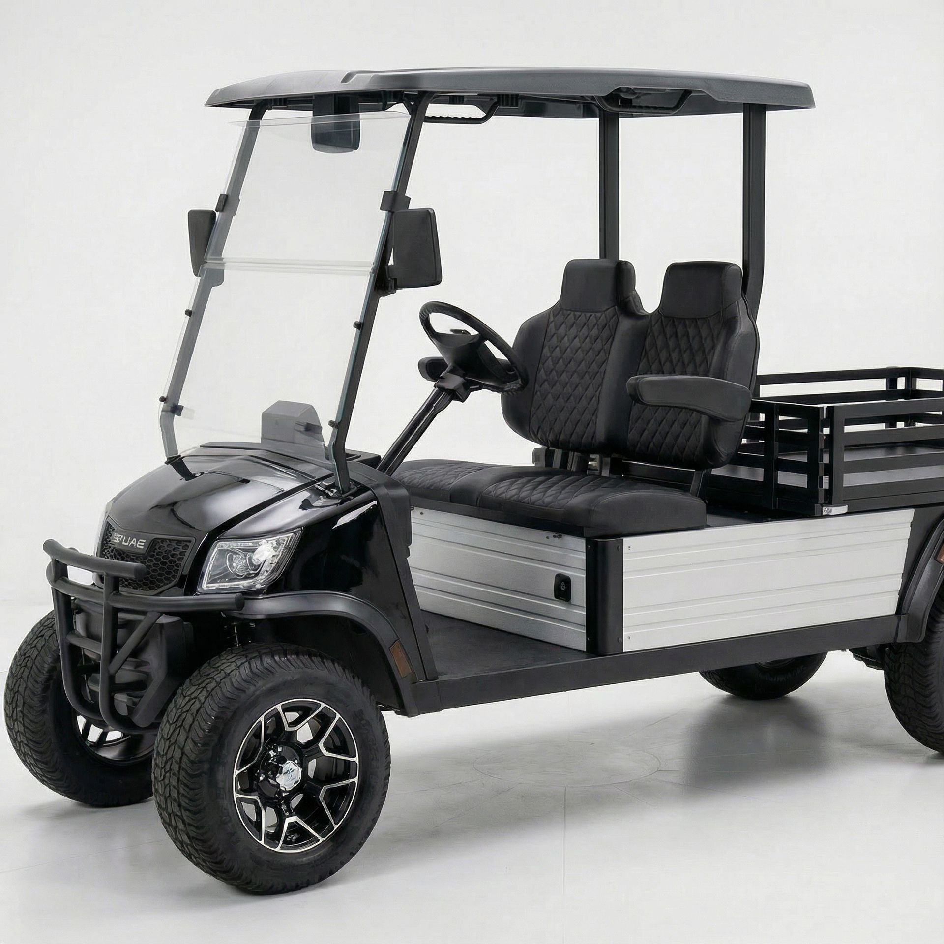 Black golf cart with a bed.