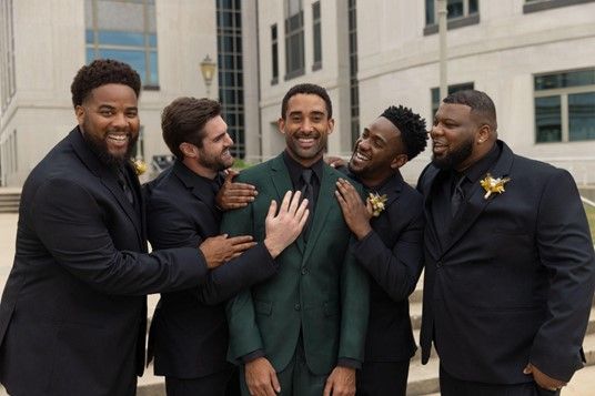 A group of men in suits are posing for a picture - Salina, KS - Princess & Penguin Formalwear