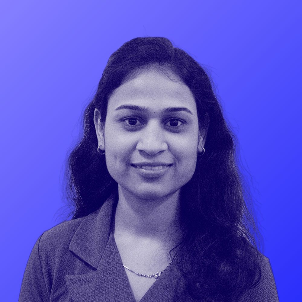 A black and white photo of a woman against a blue background.