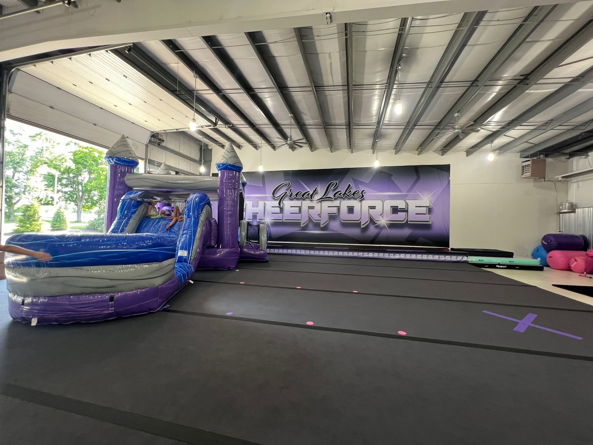 Bounce house in the middle of Great Lakes Cheer gym
