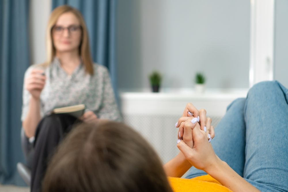 Person in Therapy Session, Holding Hands — AT My Place Counselling and Psychotherapy in Neutral Bay, NSW
