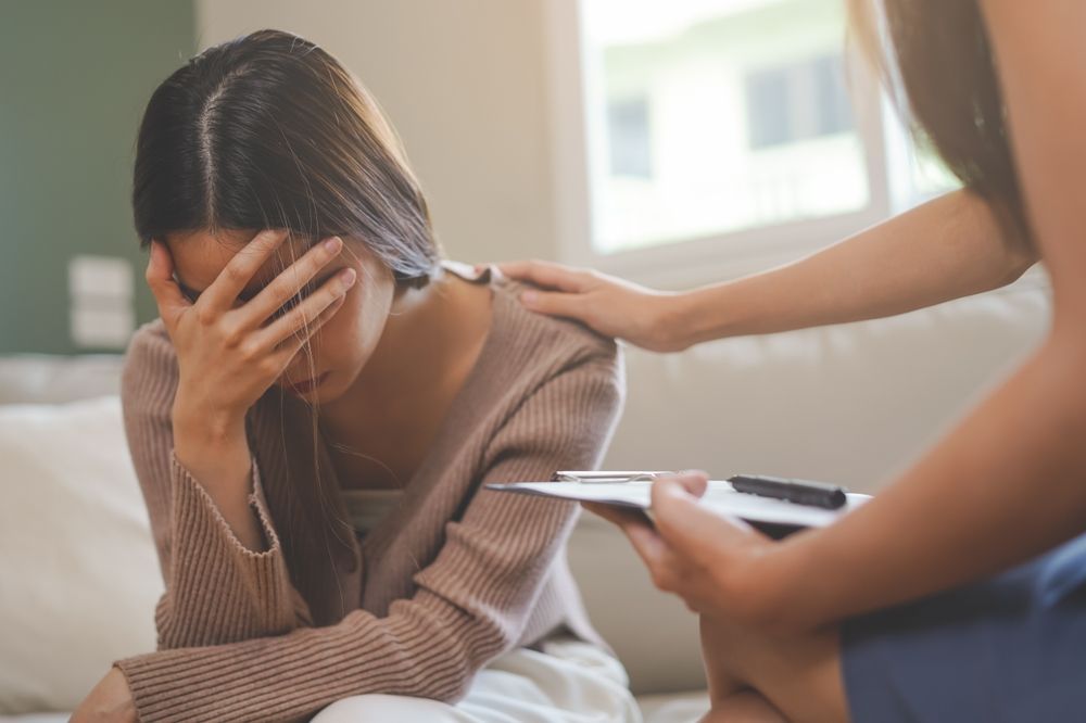 Woman With Head in Hands — AT My Place Counselling and Psychotherapy in Neutral Bay, NSW