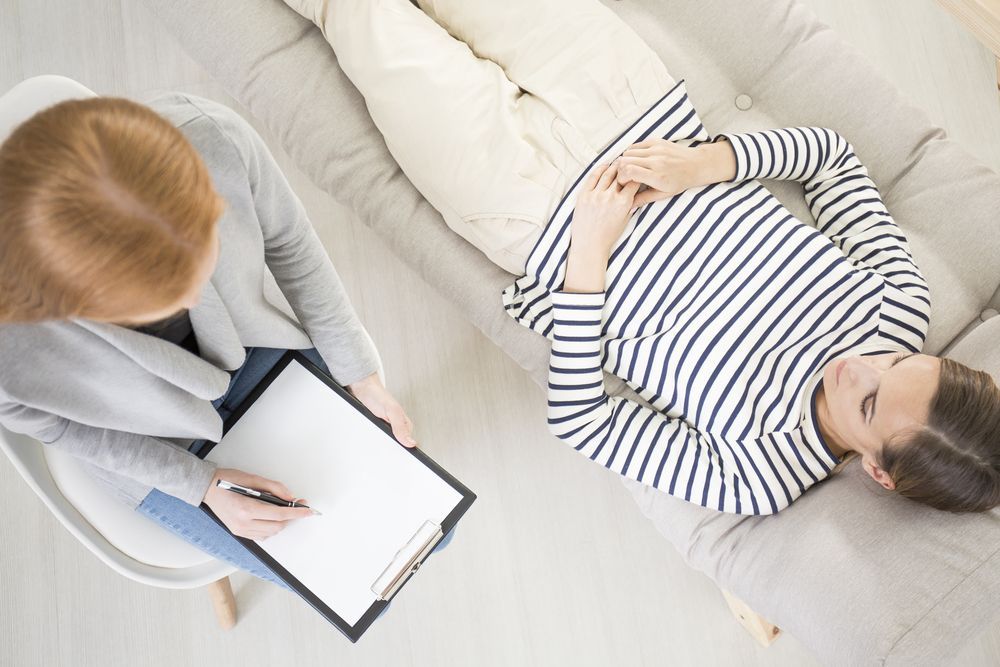 Therapist Taking Notes, Patient Lying on a Couch — AT My Place Counselling and Psychotherapy in Neutral Bay, NSW