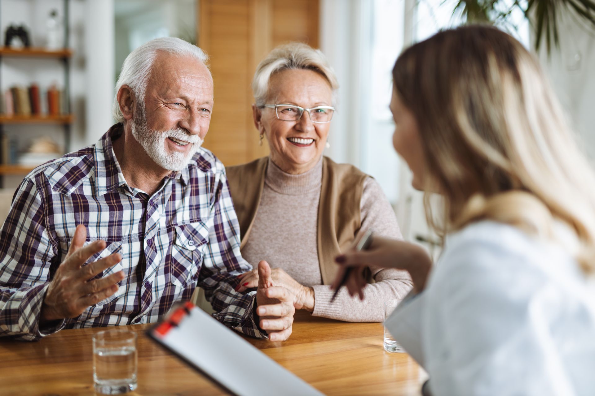 Senior couple going over insurance plan options Senior couple going over insurance plan options